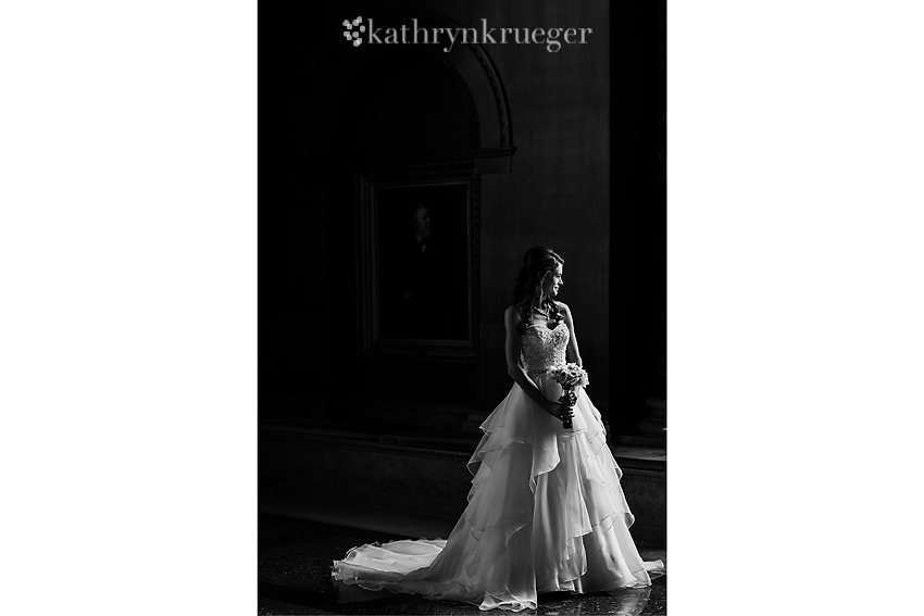 Black and white full-length bridal portrait.