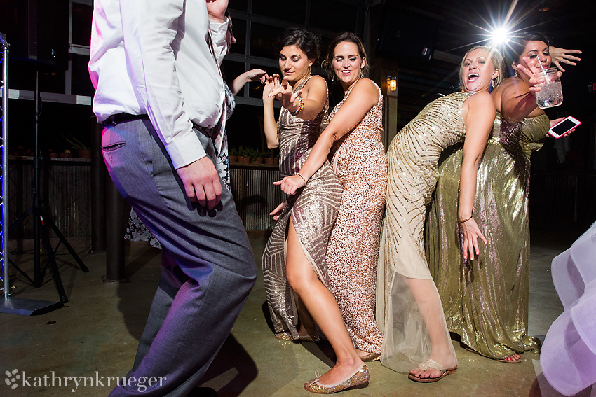 Bridesmaids dancing together.