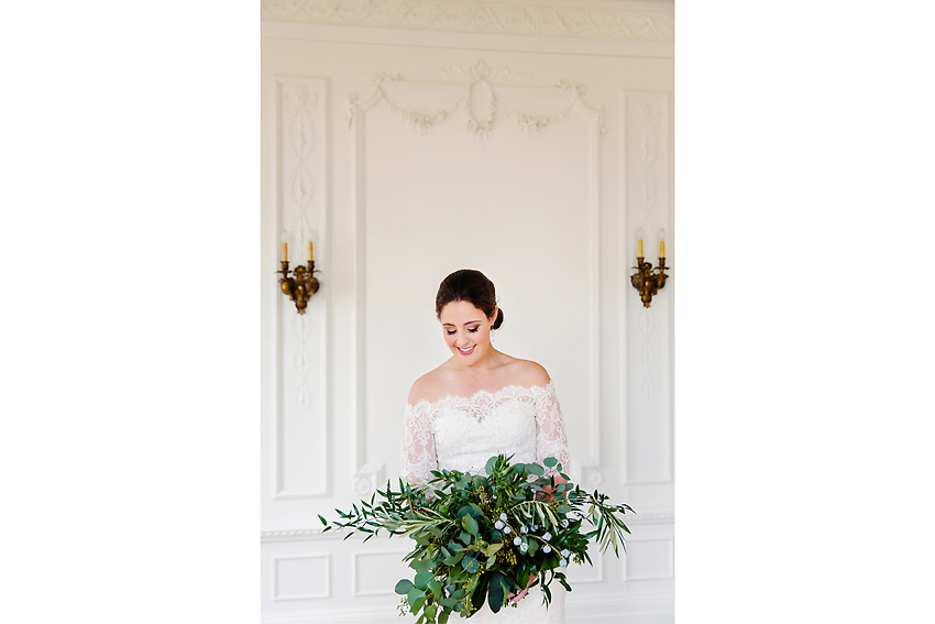 Smiling bride in a lace dress