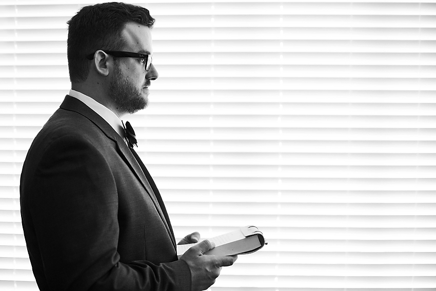 Black and white portrait of groom.