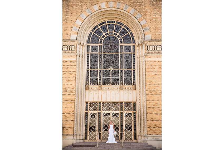 Bridal portrait standing outside of church.