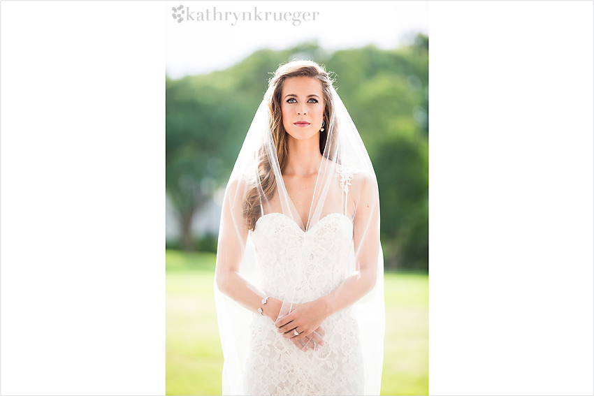 Bridal portrait draped in veil.