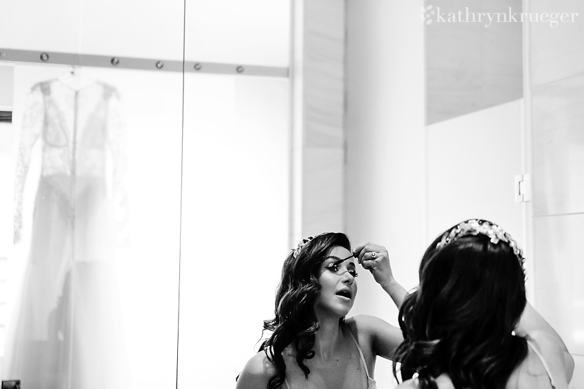 Bride putting on makeup