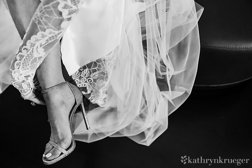 Bride putting on shoes