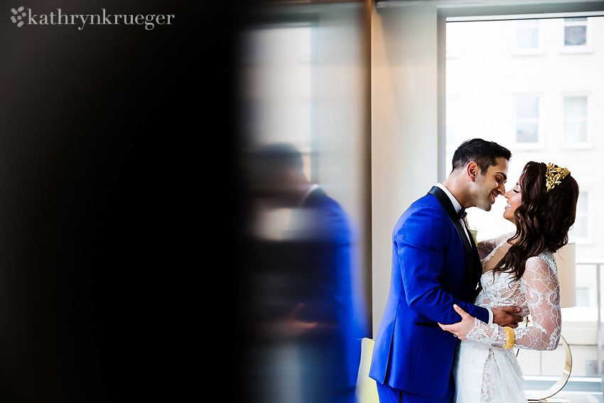 Groom kisses elegant bride