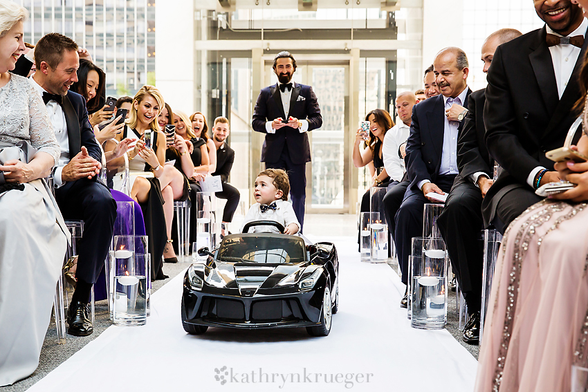 Ring bearer goes up aisle in remote control Ferrari 