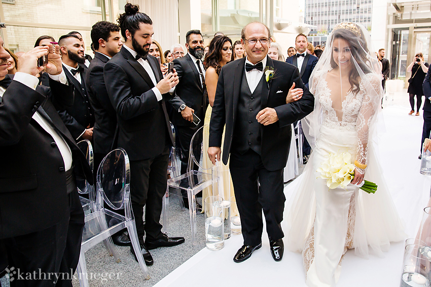 Bride walks up the aisle with father