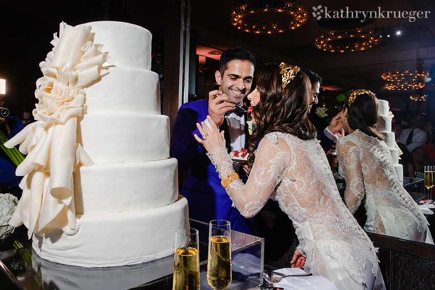 Bride and Groom eat wedding cake