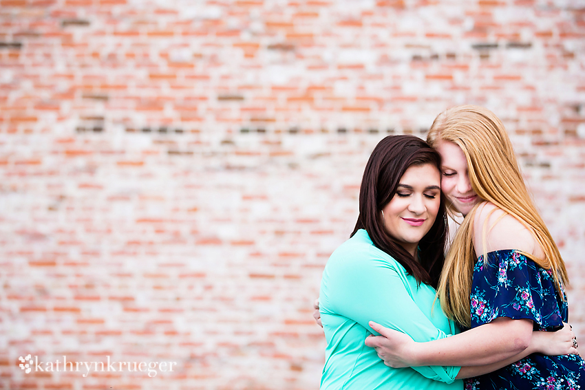 Portrait of sisters hugging.