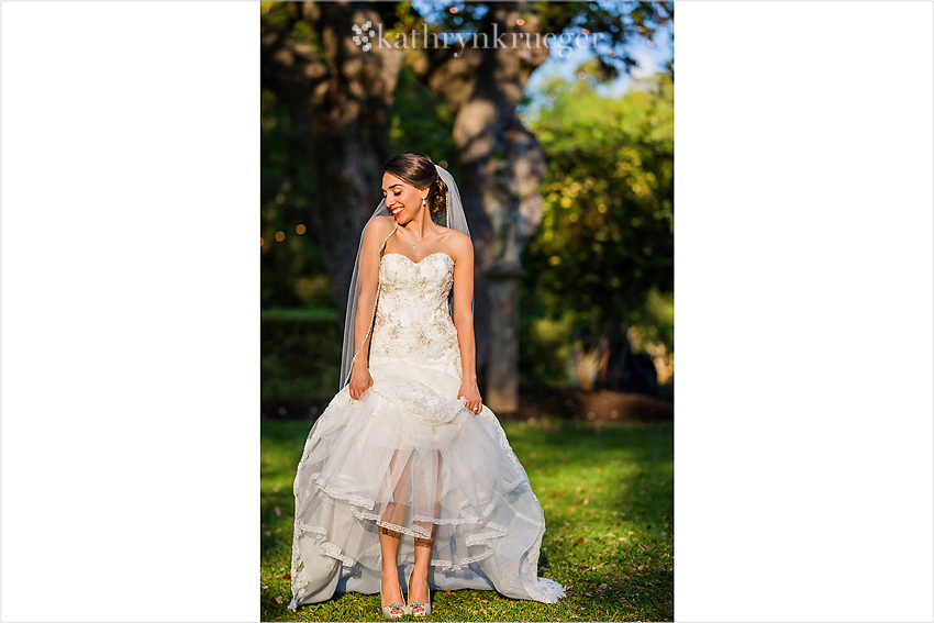 Bride playfully showing off her shoes.