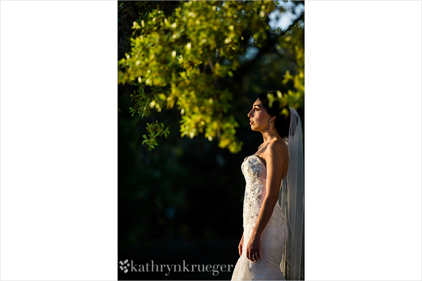 Bride stands looking off the the left.